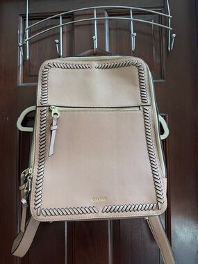 Calpak taupe leather backpack with whipstitch detailing
